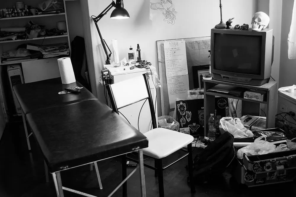 Warmly lit private tattoo studio